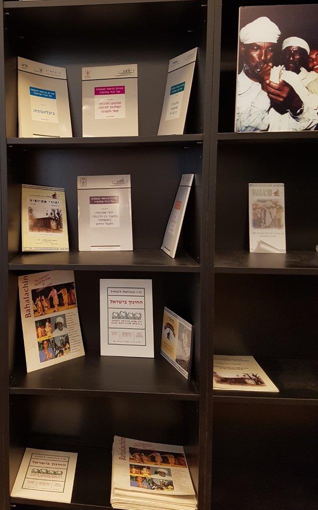 Photo of bookshelf with Bahalachin's Publications